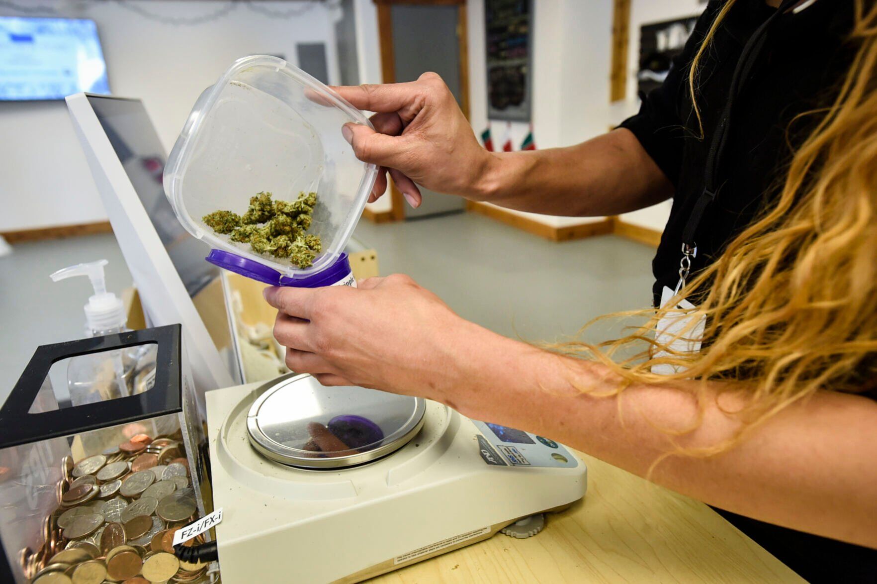 Rochelle Porter packages marijuana buds for a customer